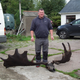 Raymond McElroy pictured with the antlers and skull of a Great Elk.